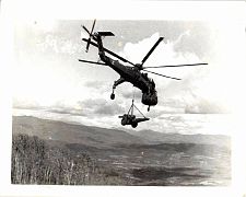 CH 54 Skyhook flying from FSB-6 to DAK TO, Central Highlands, Vietnam, about 1970.